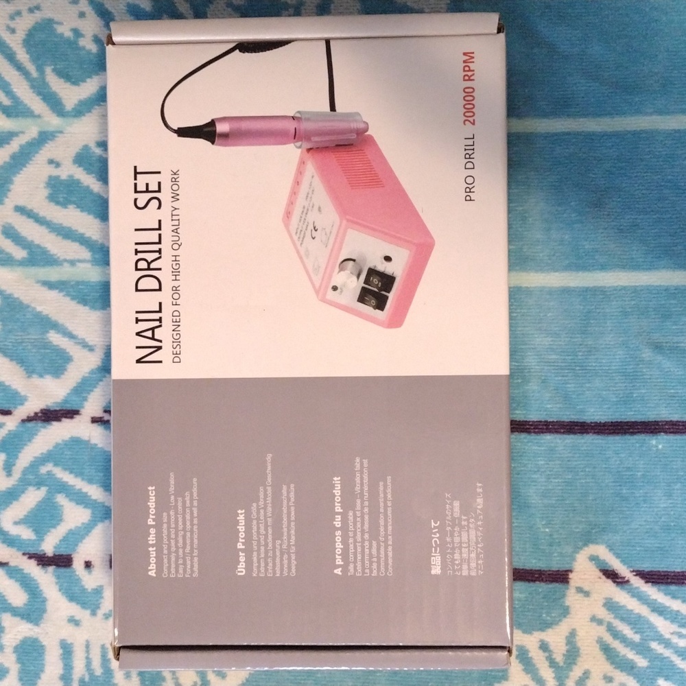 A Nail Drill/Dremel Set, by Pro Drill. Comes in Pink